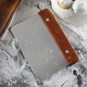 Stainless steel scraper lifting cookies without damage