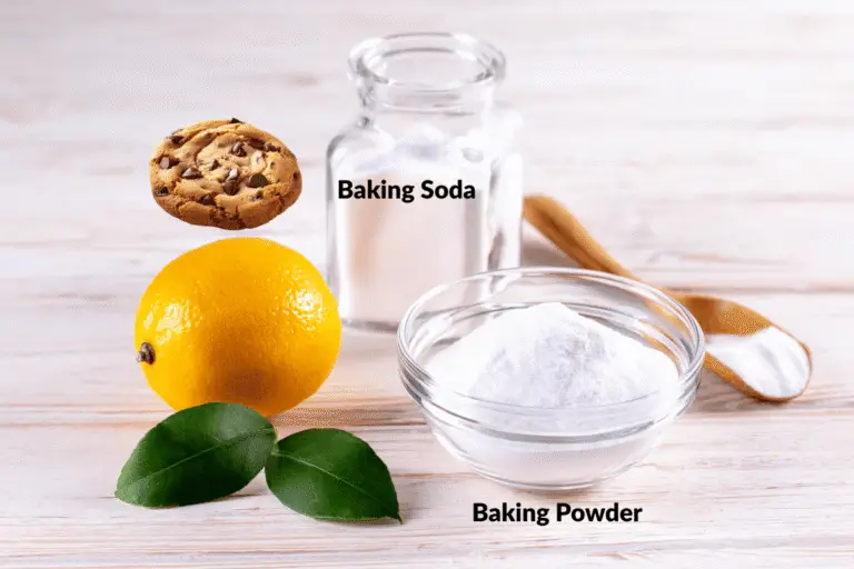 Baking soda vs baking powder in cookies, labeled jars and bowls on a light wood background with lemon and cookie for context