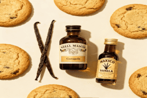 Chocolate chip, sugar, and oatmeal cookies with bottles of vanilla – best vanilla for cookies